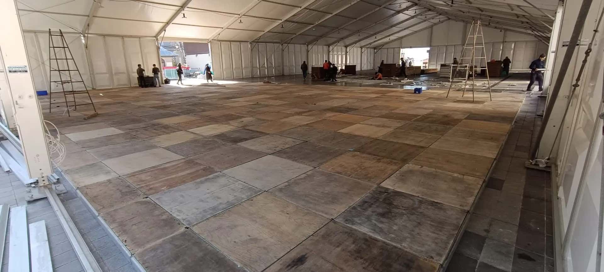 Industrial tent setup providing storage and production space