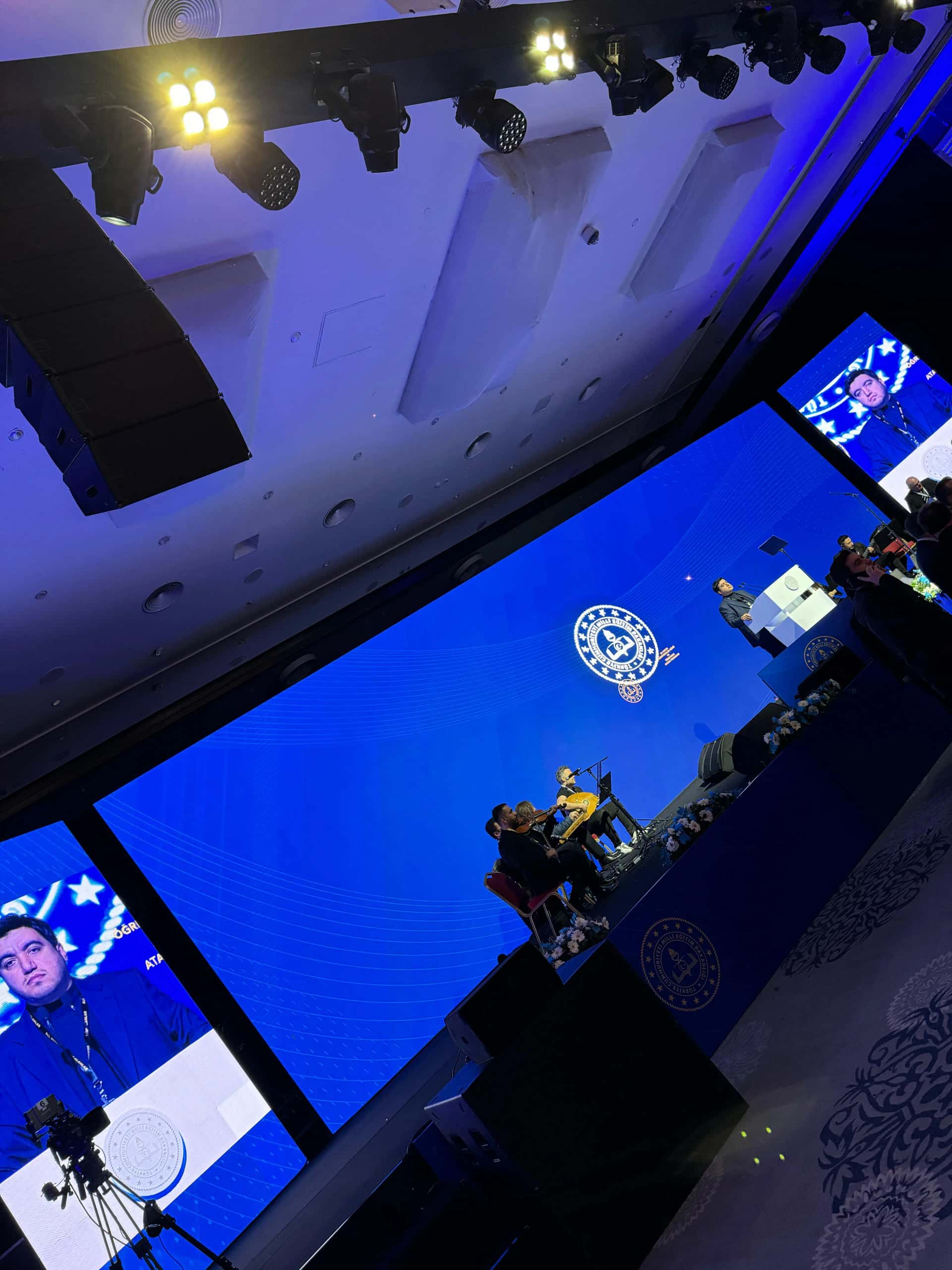 Corporate launch stage with branded backdrop and LED wall integration